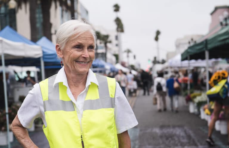 Laura Avery at Farmers Market in yellow vest