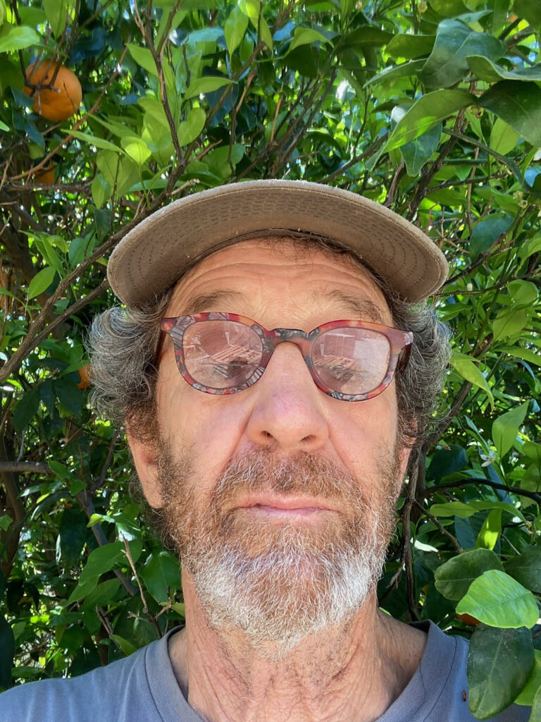 Jim Churchill selfie in front of citrus plant