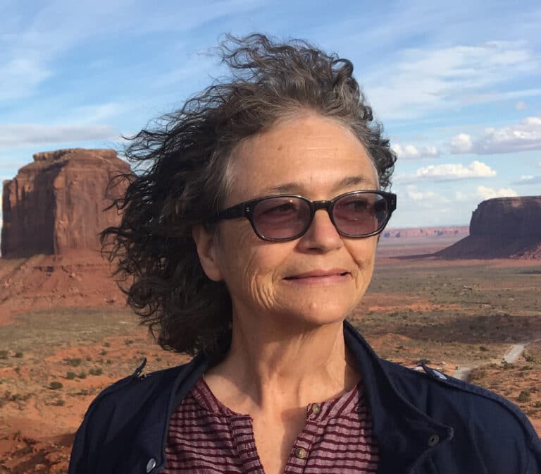 Lisa in sunglasses in desert