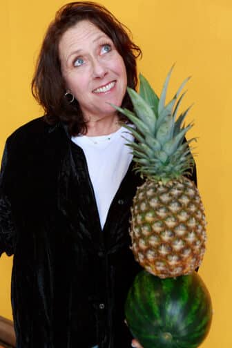 Jodi holding a pineapple