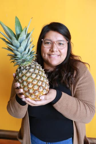 Angie holding pineapple